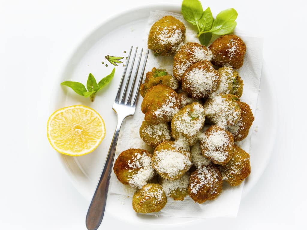 vegetable balls made of peas and courgettes. vegetarian meatballs. on white